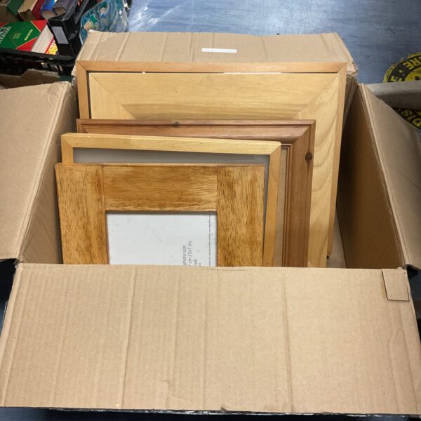 Assorted wooden photo frames in a mixed lot, ready for display.