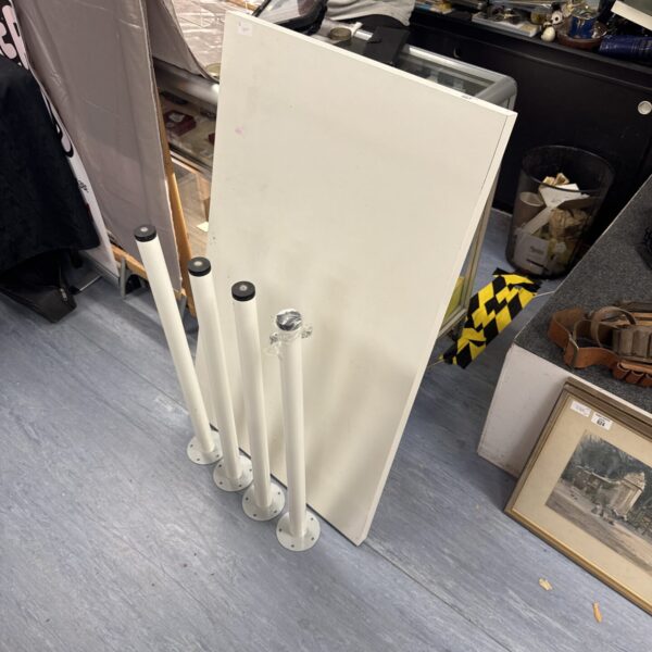 White IKEA Linnmon table with legs, ideal for a home office.