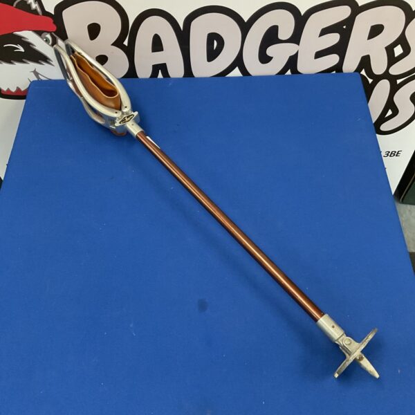 Vintage shooting stick with worn leather seat for game shooting.
