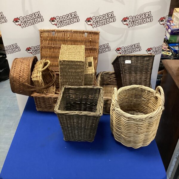 Assorted vintage wicker baskets in a job lot for storage and display.