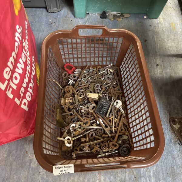 Basket of assorted vintage keys, antique key collection.
