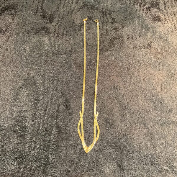 Vintage gold filled necklace with a delicate curving design.