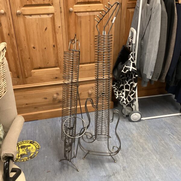 Vintage metal CD racks shaped like saxophone and guitar.