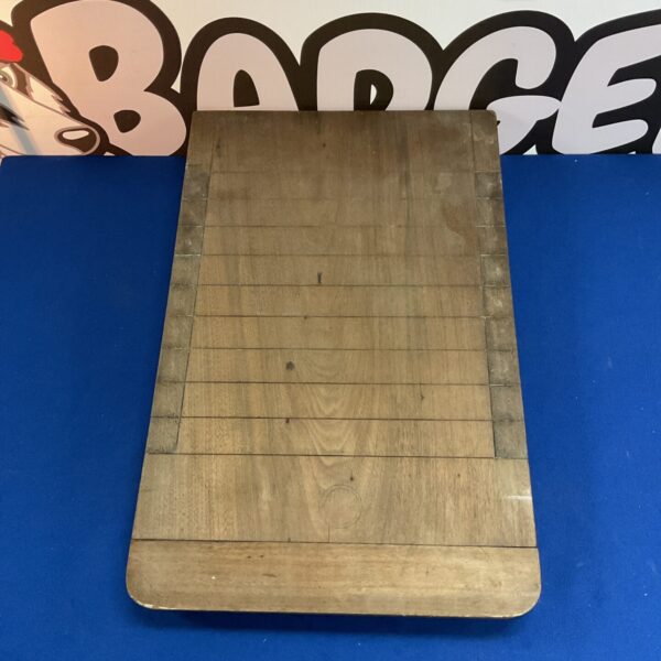 Vintage shove ha’penny board with numbered scoring areas.