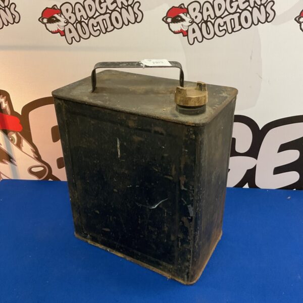 Vintage metal fuel can with brass cap for collectors.