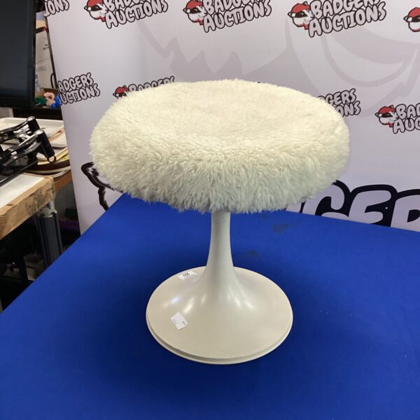 Vintage white fur bedroom stool with wooden legs.