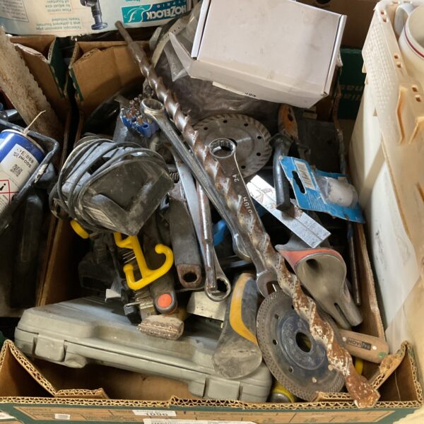 Mixed tool lot including spanners and drill bits for DIY projects.