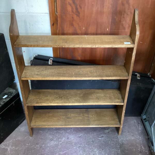 Vintage mahogany bookcase with three shelves for books and display.