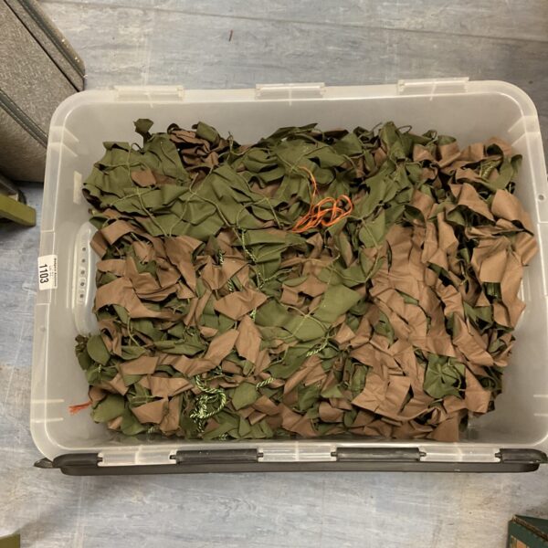 Bulk lot of camouflage netting for outdoor use.