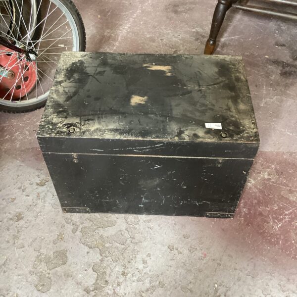 Vintage wooden chest with signs of age and wear.