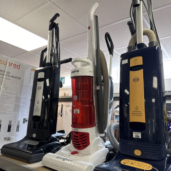 Red and black vintage Hoover Smart upright vacuum cleaner.