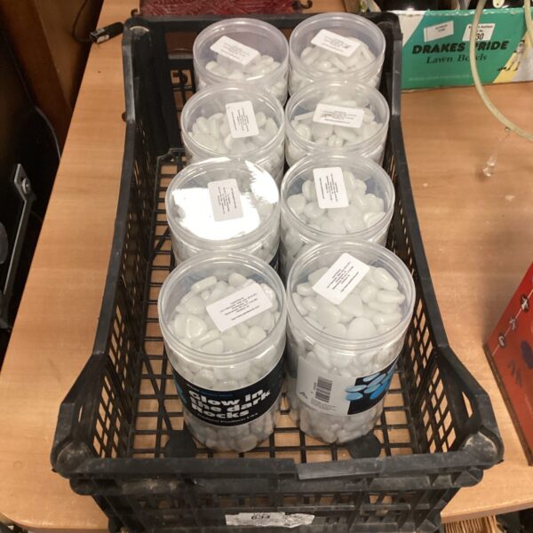 Eight boxes of glow in the dark rocks for garden or party use.