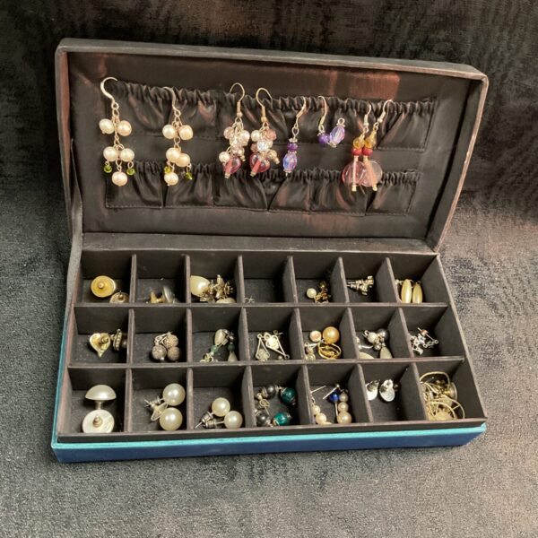 Vintage earring collection lot with diverse styles and designs.