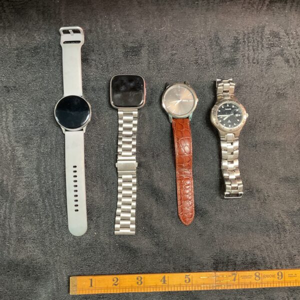 Mixed watch lot including Samsung Galaxy Watch and Fitbit.
