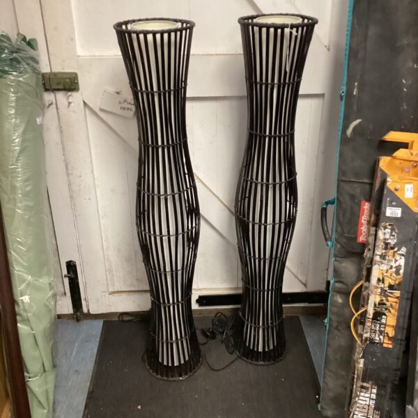 Pair of tall modern floor standing lamps for ambient lighting.
