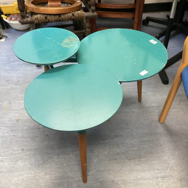 Vintage three tier coffee table with tiered design and tapered legs.