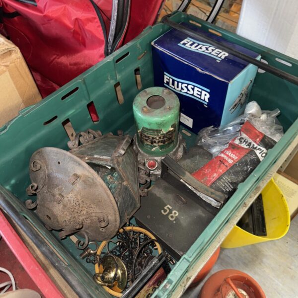 Vintage shed clearance lot with lantern and tools.