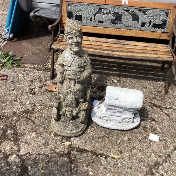Vintage garden gnome and caravan ornament set for collectors.