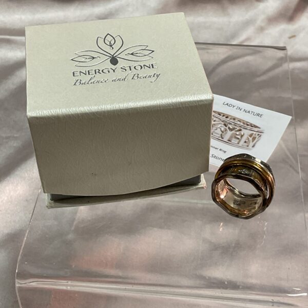 Silver energy stone ring with spinner detail, size M.