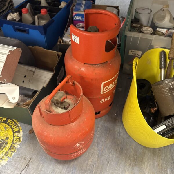 Lot of two patio gas bottles for outdoor use.