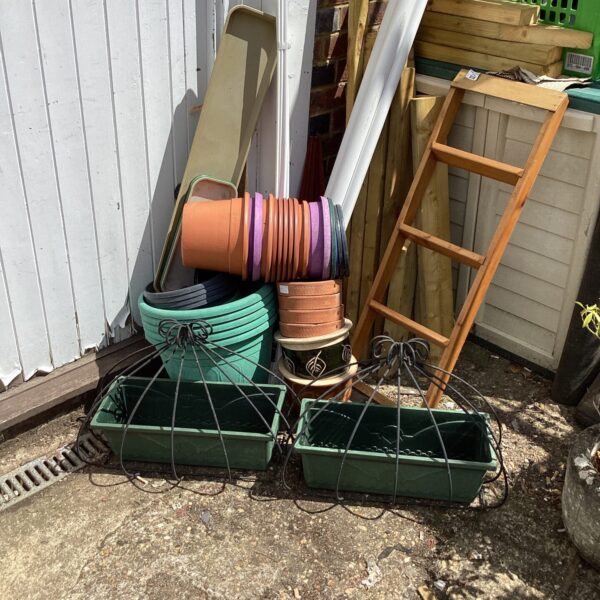 Large lot of assorted garden planters and tubs for outdoor use.
