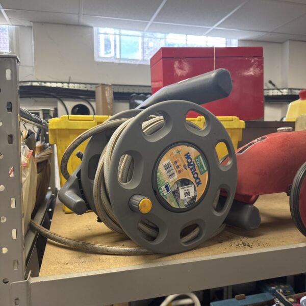 Used Hozelock hose reel for garden hose storage.