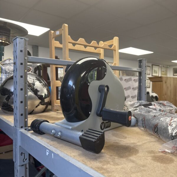 Side view of a Vfit pedal exerciser for home fitness.