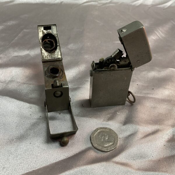 Vintage military petrol lighter and inkwell set, brass construction.