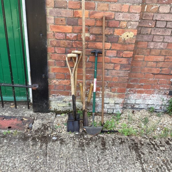 Vintage garden tools lot including a spade and shovel.