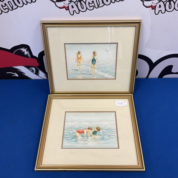 Vintage watercolour painting of children playing on the beach.