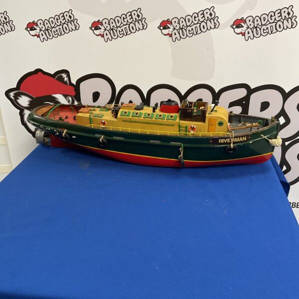 Side view of the radio control Riverman barge model boat.