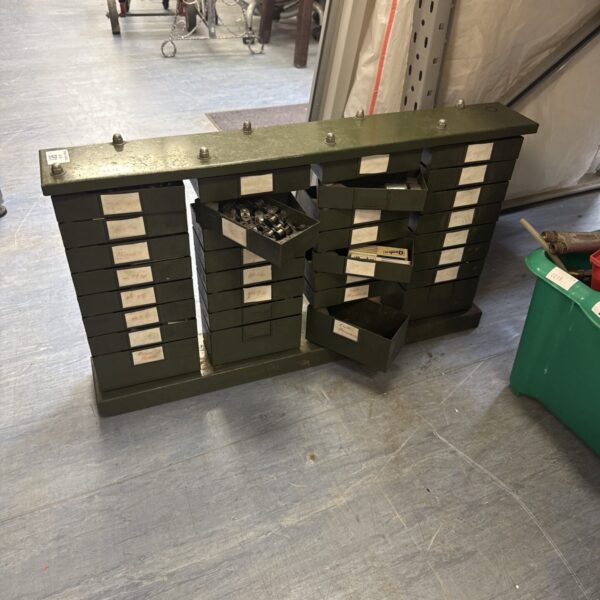 Vintage engineers drawer cabinet with revolving drawers for tool storage.