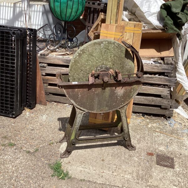 Antique blade sharpener with large grinding wheel for sharpening tools.