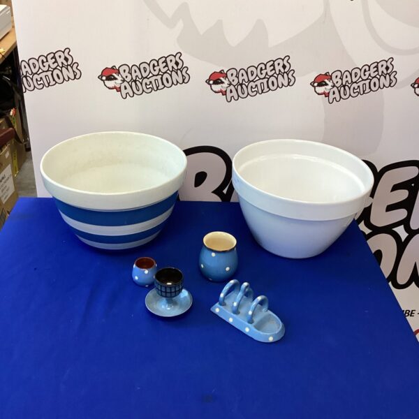 Vintage enamel mixing bowls, white and green, kitchen storage.