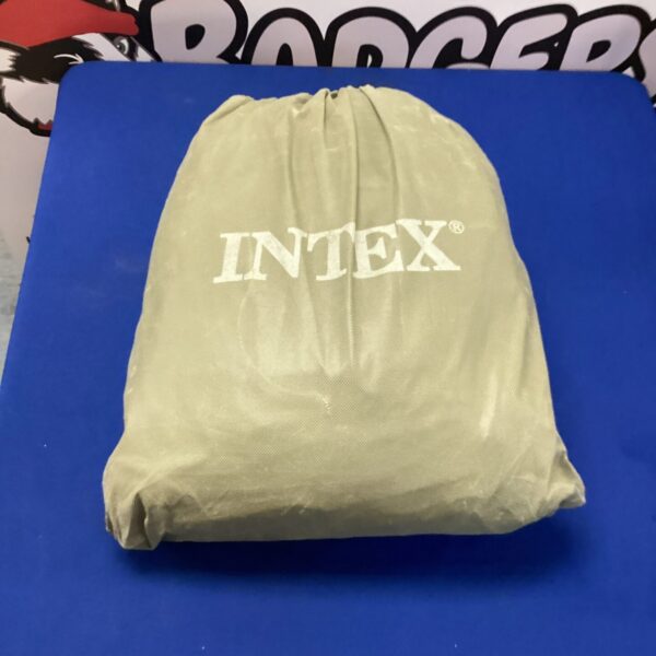 Rolled Intex double air bed for camping or guest use.