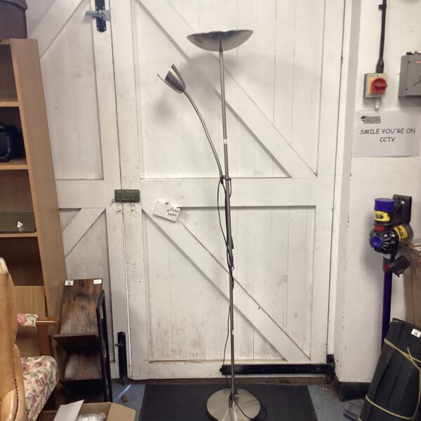 Chrome floor standing uplighter with adjustable reading lamp.