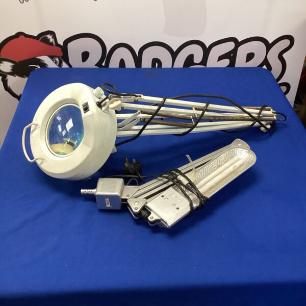 Two workshop lights, one with a magnifying glass, for detailed work.
