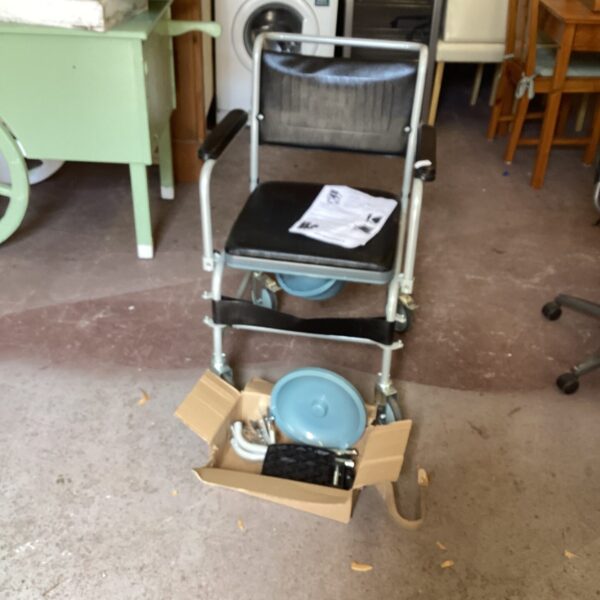 Elite Care commode chair with folding frame and armrests.