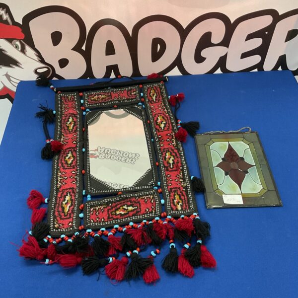 Vintage Islamic carpet mirror with colourful glass and tassels.
