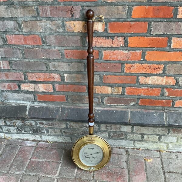 Antique Victorian brass Skule barometer in warming pan form.