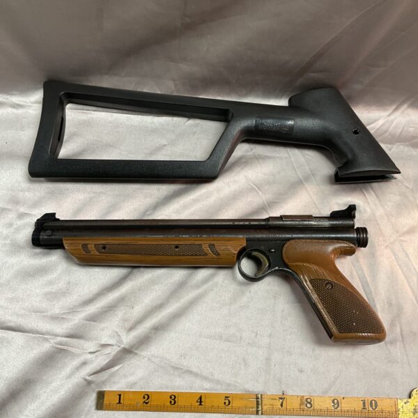 Vintage Crosman 13377 numatic pistol with brown stock.
