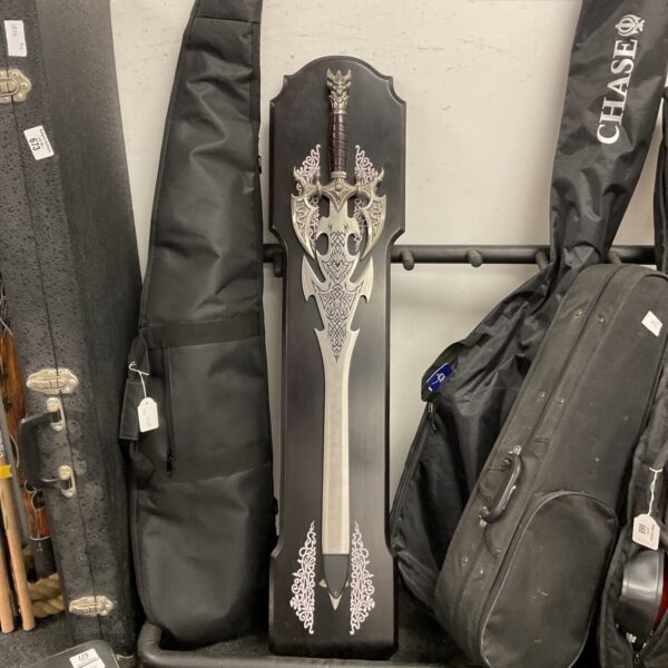 Large fantasy sword with intricate detailing, ideal for display.