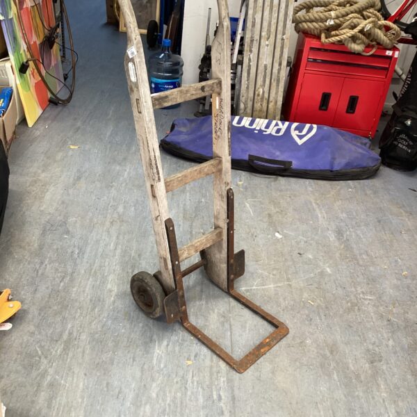 Vintage Slingsby sack barrow with wooden frame and single wheel.