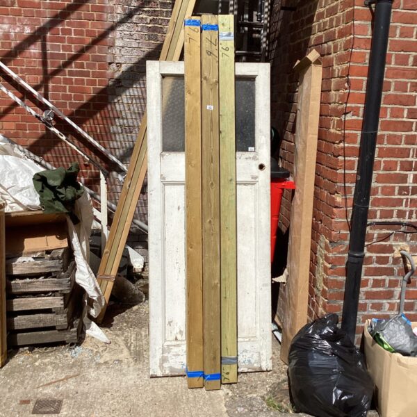 Three bundles of 7’6” timber stacked outdoors.