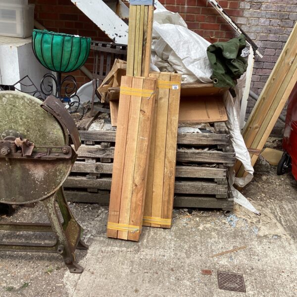Stack of timber bundles outdoors, suitable for DIY projects.
