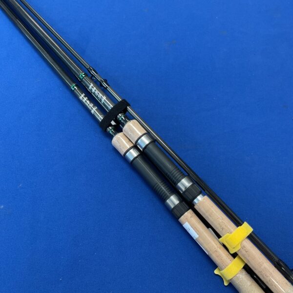 Pair of Darent Valley fishing rods on a blue surface.