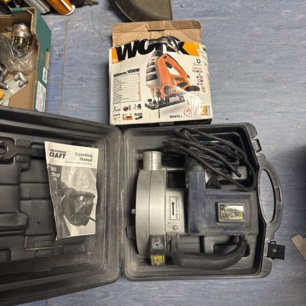 Worx jigsaw with Powercraft wall chaser attachment for DIY projects.