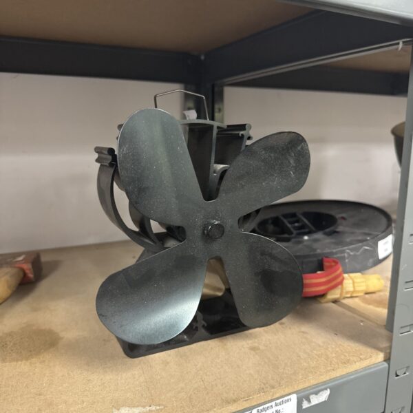 Metal stove fan for efficient heat circulation.