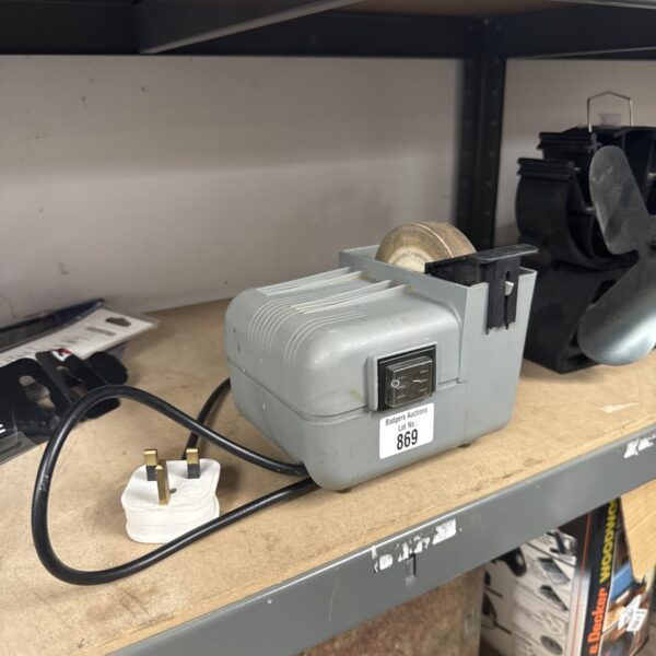Used bench grinder wheel for metalworking and workshop tasks.