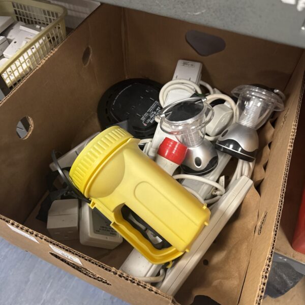 Tray of assorted electrical timers and components for repair or collection.
